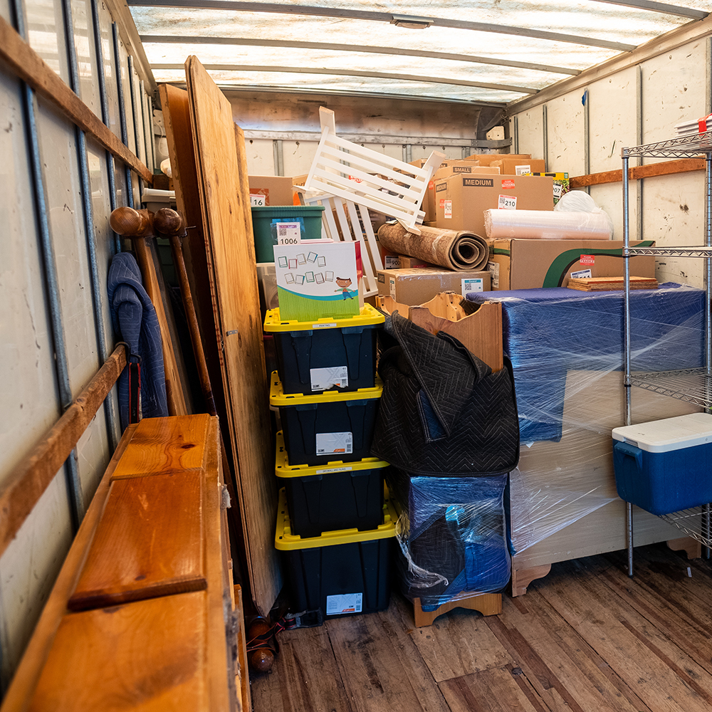 Belongings from a house being loaded into a storage unit